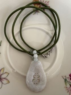 Jade pendant necklace, with Asian auspicious symbols to bring good fortune