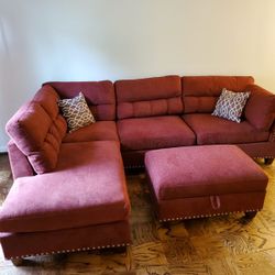 Brand new red Velvet like Sectional Sofa with storage ottoman and 2 accent pillows.