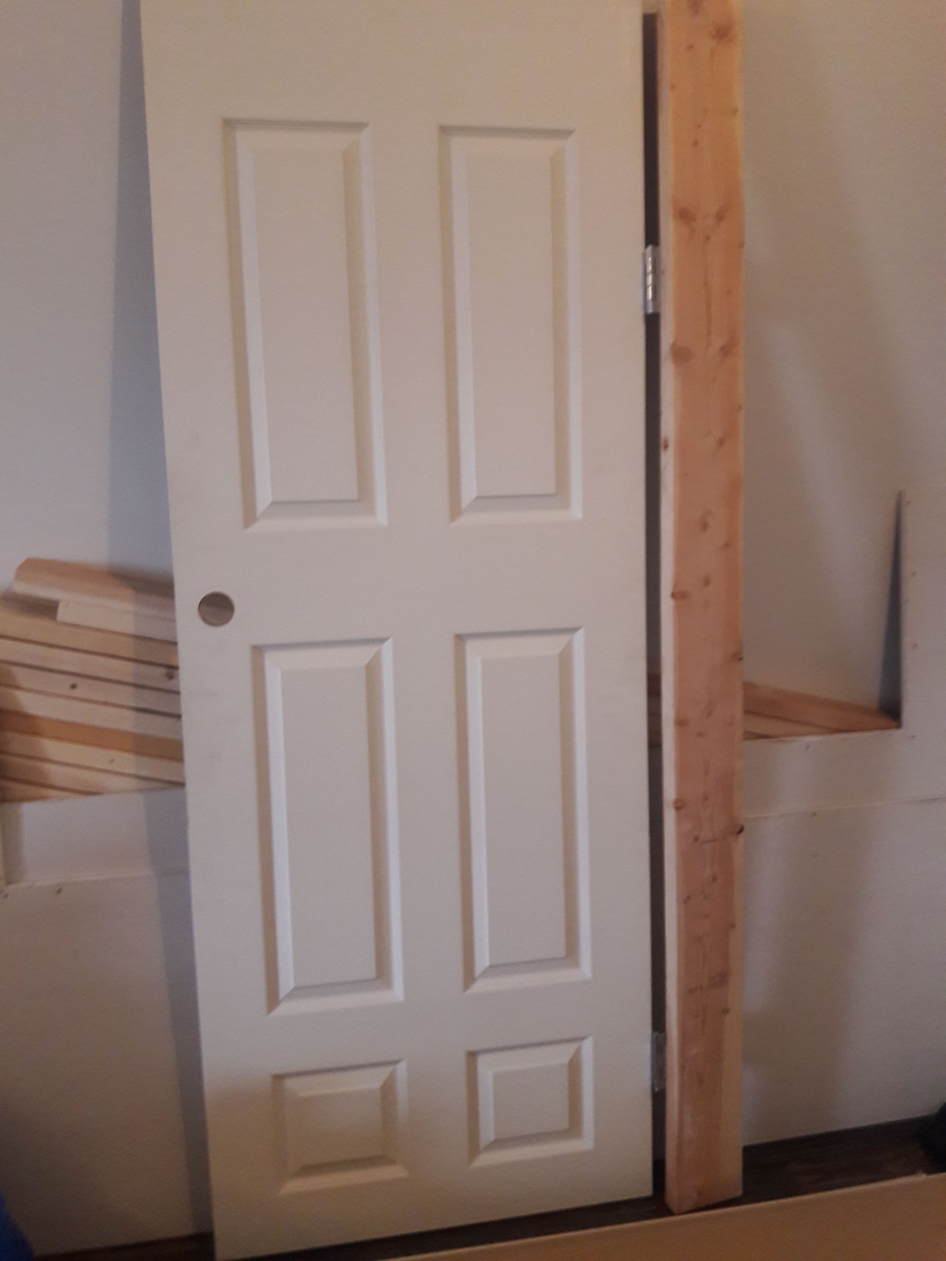 Door and wood. new 30x80, two pieces of sheetrock 4x8, assorted 2x8 pieces