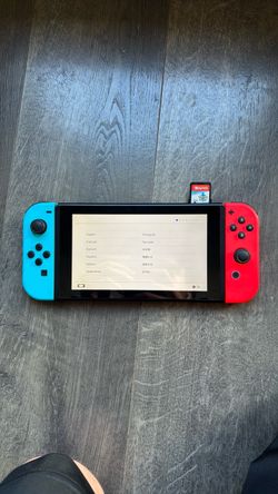 Nintendo Switch + Game & Charger