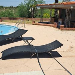 2 Pool Chairs With A Table