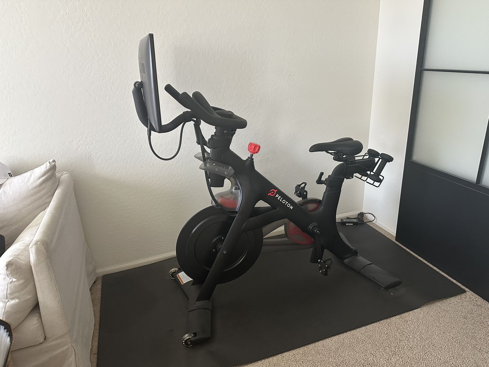Like New Peloton Bike + Accessories (Shoes, Weights, Mat) – Barely Used!