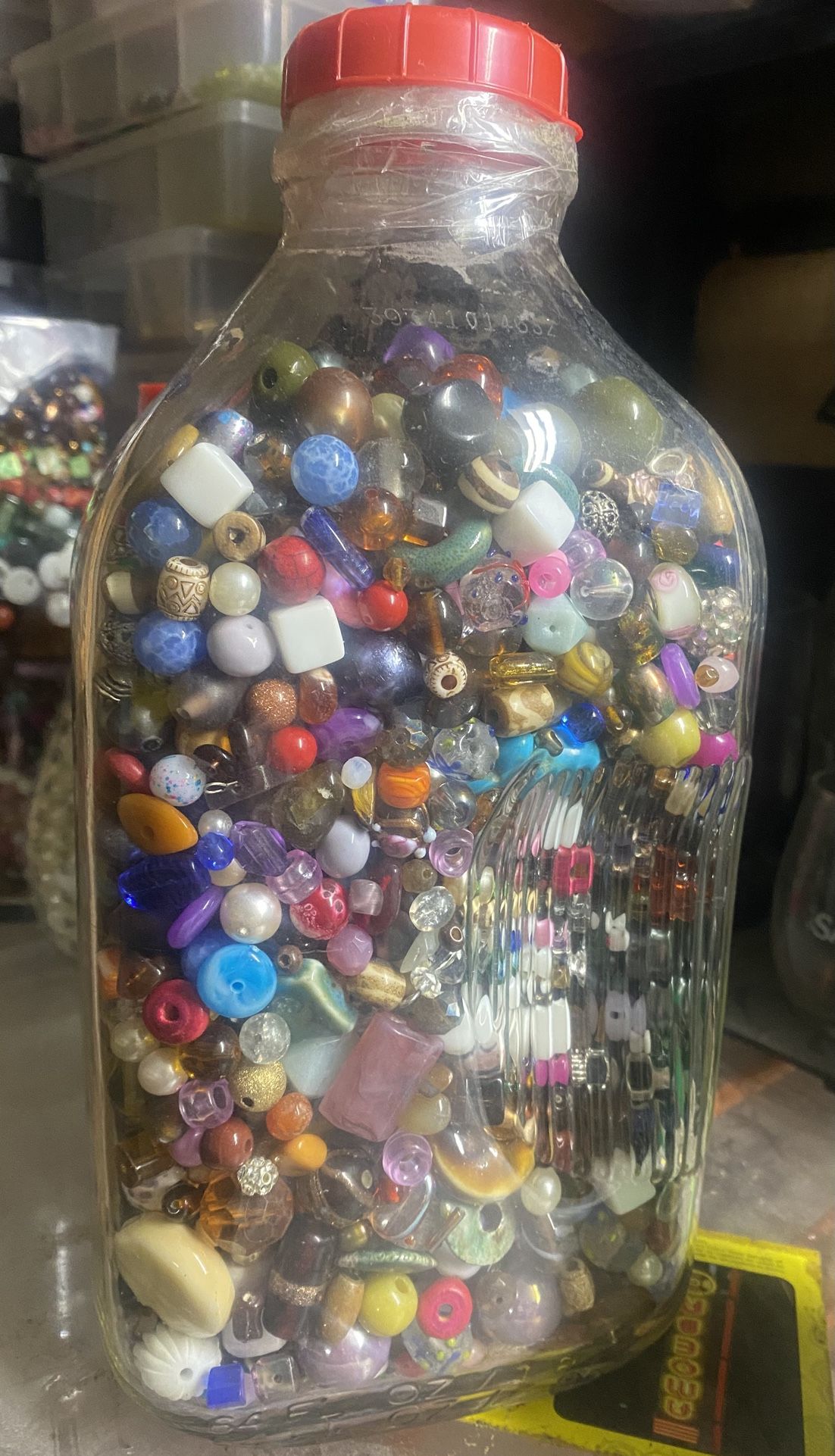 Large Glass Container full Of Beautiful Beads