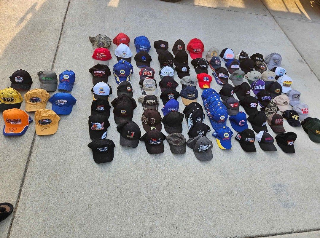 111 pc Racing collection hats , including 8pc with racers autograph.