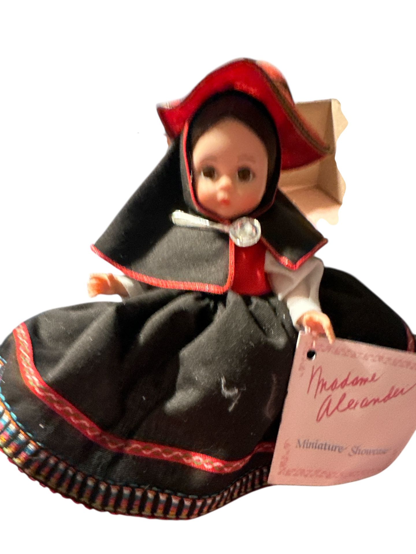 Madame Alexander doll, specifically the "Peru" doll from the International Series, which was made between 1950 and 1960. The doll is an 8-inch represe