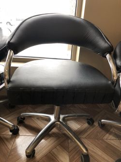 4 black leather chairs
