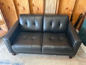 Black leather love seat