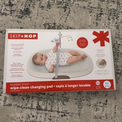 Skip Hop Baby Changing Pad Nursery Style Wipe-Clean Contoured with Cushioned Foam, Non-Skid Base, Built-in Safety Belt & Tuck-Away Toy Bar Fits Standa