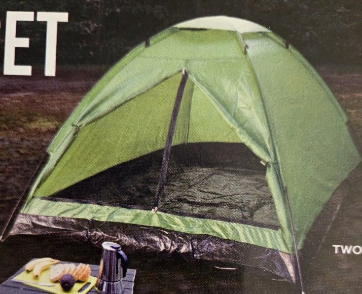 Camping equipment - Pup tent, sleeping bag, and small side table.