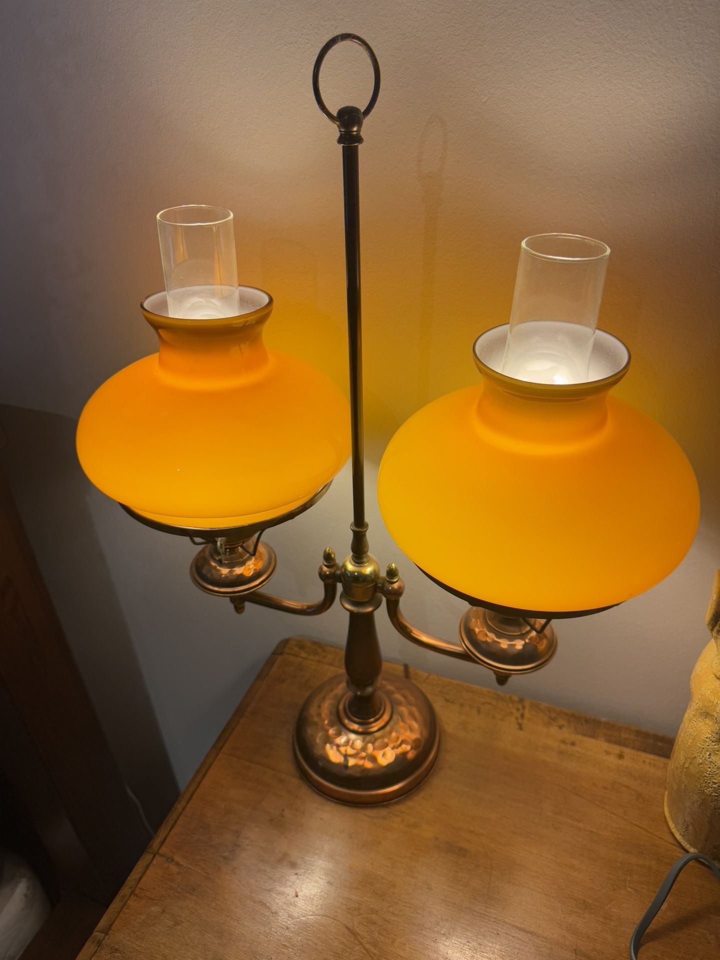 Antique double-arm brass student lamp with butterscotch glass