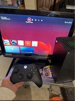Xbox Series X with 2 controllers