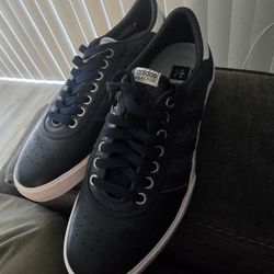 Adidas Lucas Premiere skate shoes in an all-black colorway with a white sole.