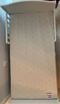 Kids bed, mattress and 2  swing down double sided bed rail.