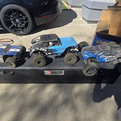 Three rc cars kraton 6s, blackout, and redcat