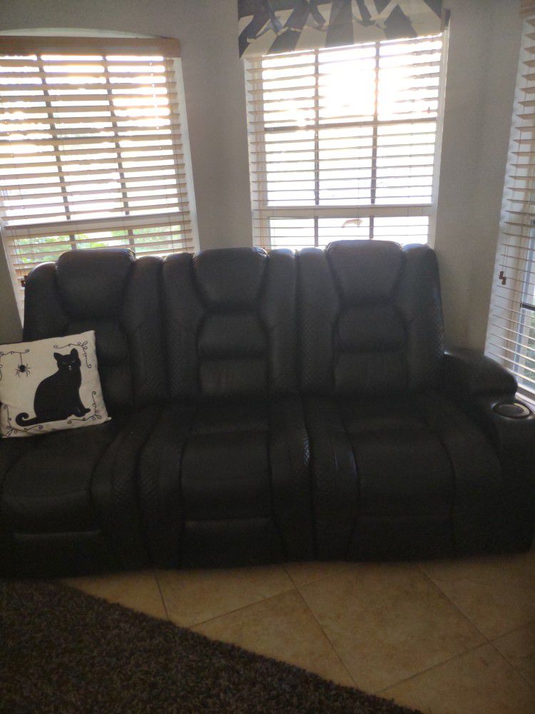 Theater Room Double Reclining Leather Couch. Has Plenty Of Storage Lights And Chargers Everything You Need To Set Up For Your Entertainment Needs Like