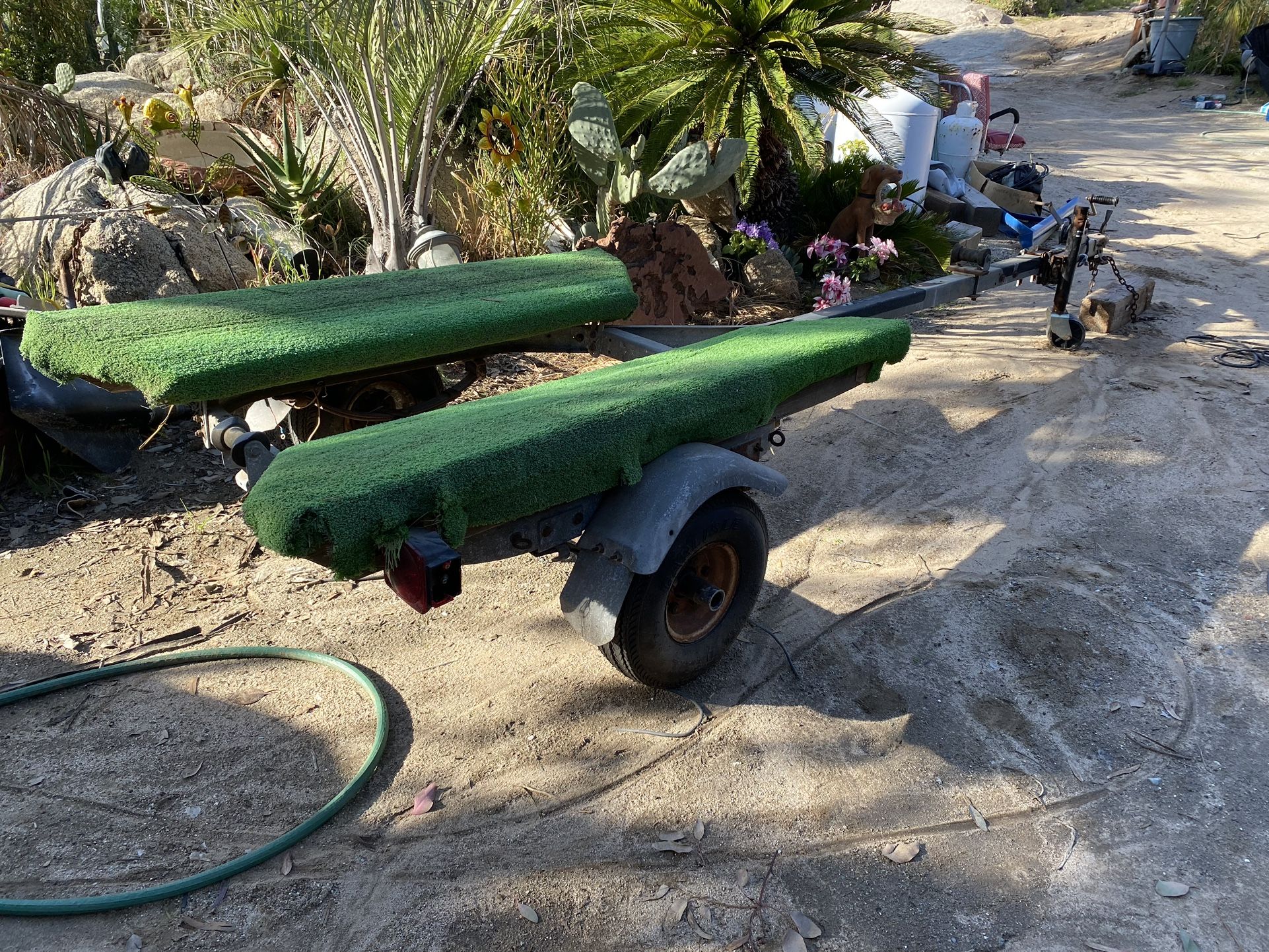 Small boat trailer specifically designed to hold it soft bottom inflatable