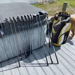 Womens set of right handed golf clubs , metal woods, putter, bag , balls and tees
