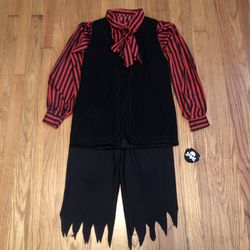 Kids size 8-10 pirate costume. Shirt, vest, pants, & eye patch. Just add a sword!