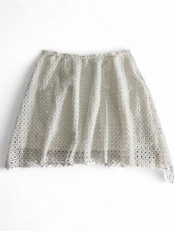 White eyelet lace skirt with circular cutouts No size tag Measurements on the pictures