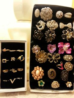 Several costume jewelry rings up for sale.