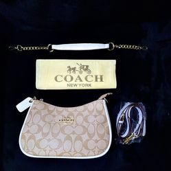 Tan and white Coach shoulder bag