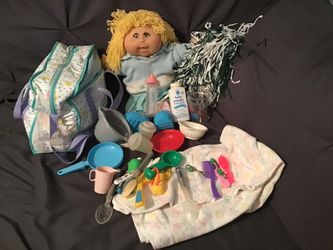 Cabbage Patch Doll Comes With Blanket, Dishes, Diaper Bag, Pom Pom, Bottle As Shown