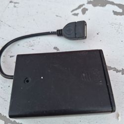 black battery case holder designed to power small devices via a USB 0503