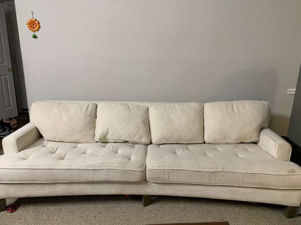 Long Curved Couch And Pillows