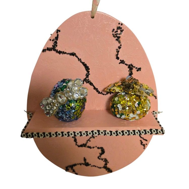 pink cracked Easter egg shaped shelf embellished with vtg jewelry