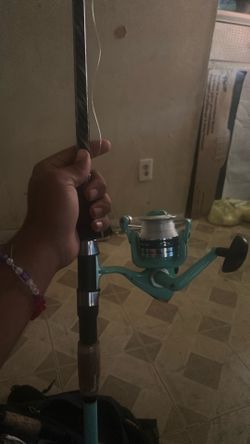 medium heavy fishing rod with bag of lures and weights