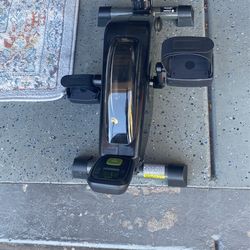 Exercise bike fits under the table. Great for circulation problems.