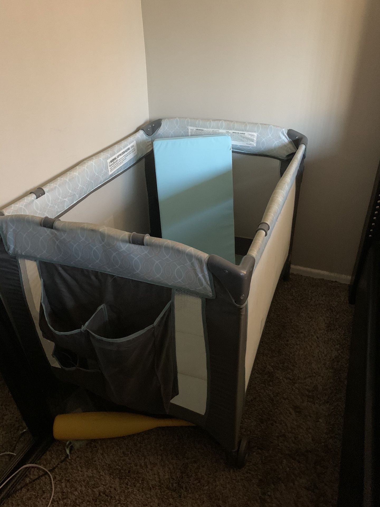 Playpen with extra padding and changing table attachment