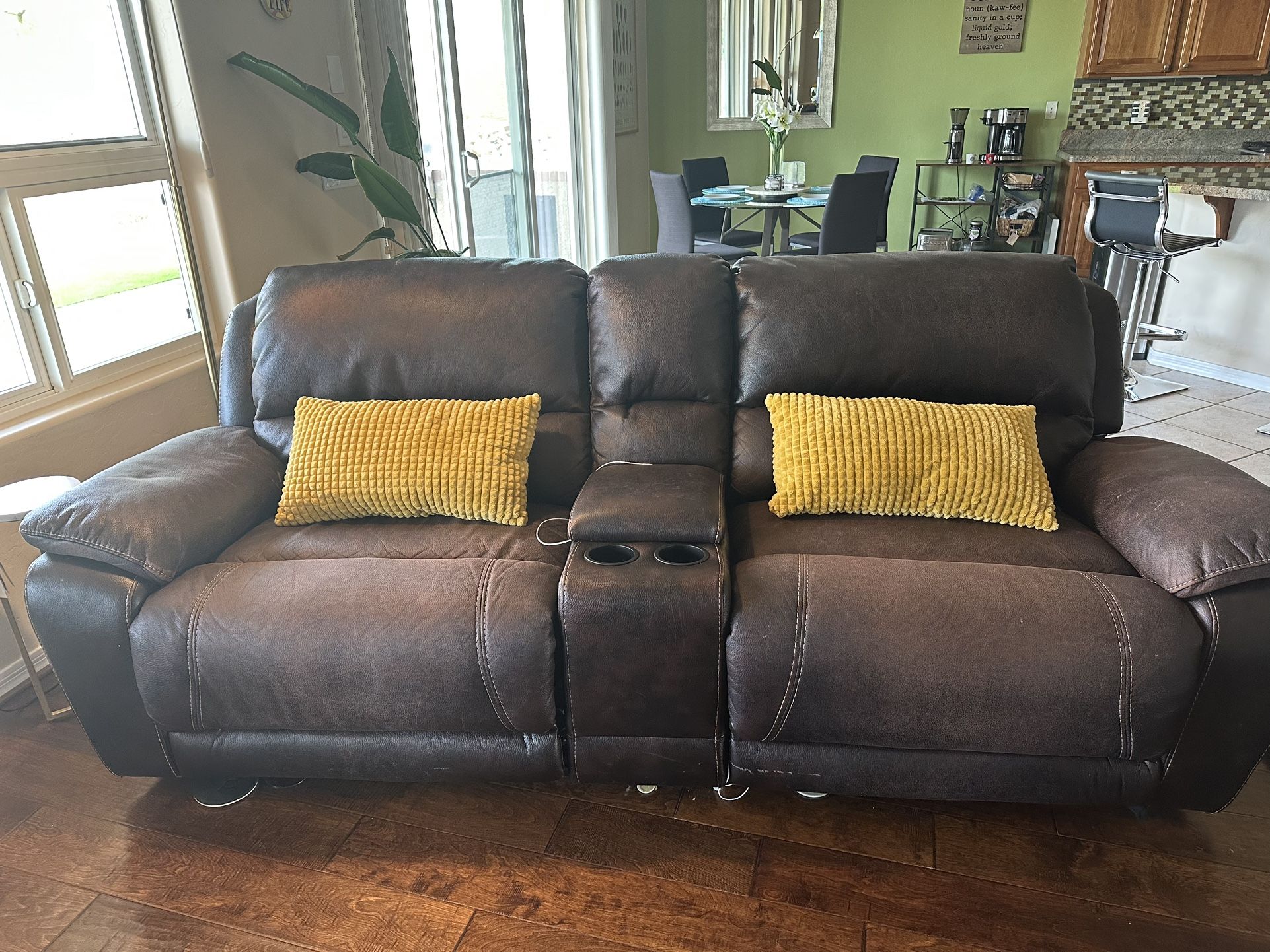 Dual electronic Leather Recliners.