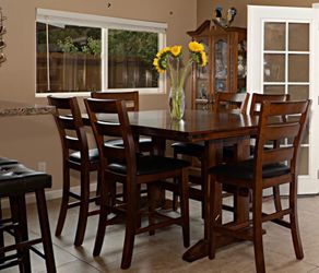 Beautiful Extendable Wooden Table with 12 chairs