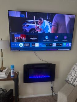 Desk and gaming chair, 65 inch Samsung flat screen smart TV 50 inch Samsung flatscreen TV ,mirror, Apple desktop computer in good condition, paper shr