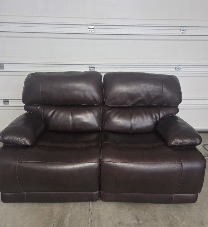 1- Dual Leather Power Recliner Sofa. Used, in very good condition.