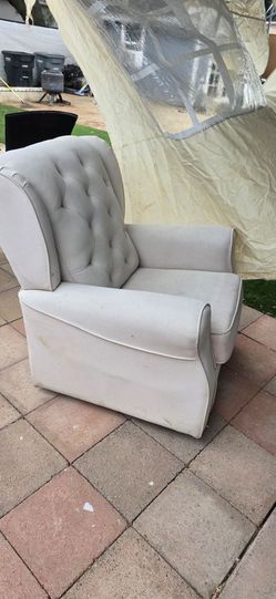 Nursering rocking sofa.   Needs to be clean.