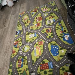 Kids play rug cars