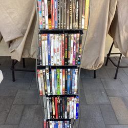 80+ DVD Movies + 5 VHS Movies And Nice Storage Shelf