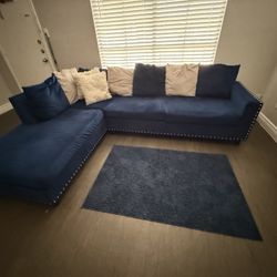 Blue Couch with a Blue Rug!