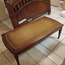VINTAGE LEATHER INLAY TOP COFFEE TABLE W/ BRASS CASTER WHEELS