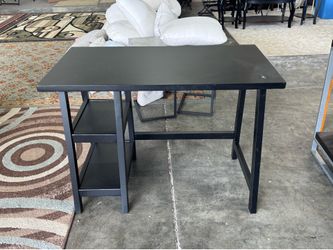 Black desk has a sanded mark on corner otherwise new