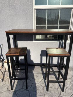 Rustic brown stools and table set