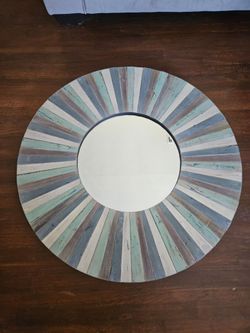 wood mirror featuring a distressed blue and white slat design