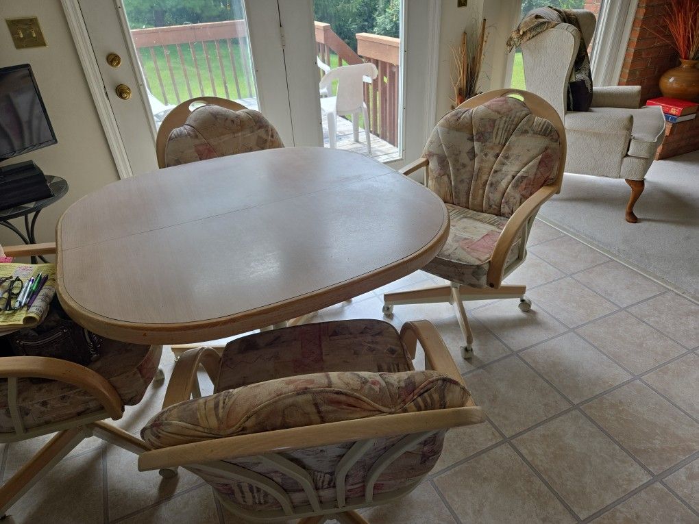 Dinette Set ,4 Chairs on rollers,all wood