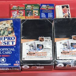 Football hockey baseball and some basketball trading cards.