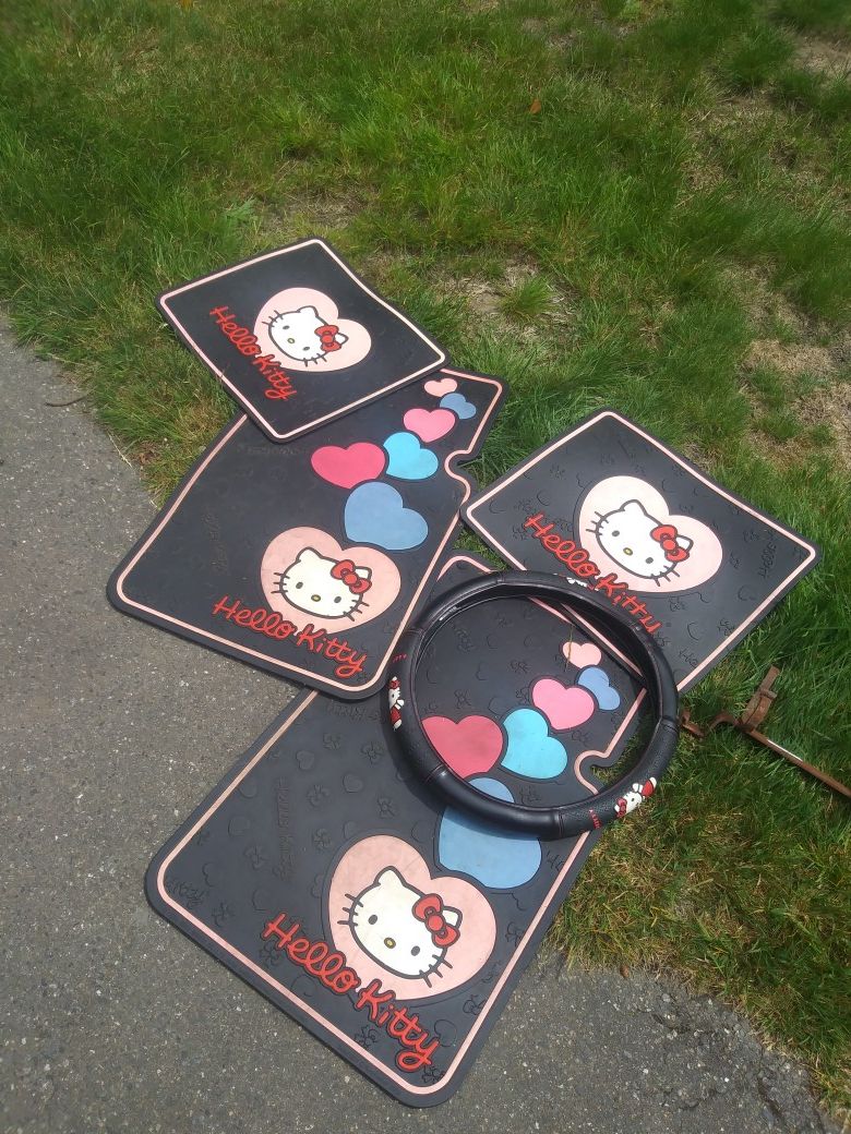 Hello Kitty 4 piece floor matt plus steering wheel cover.