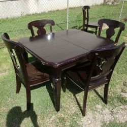 TABLE AND 4 CHAIRS HEAVY DUTY.  PAINT NEEDS TOUCHING UP OR USE   table cloth. 225.00 OR MAKE OFFER