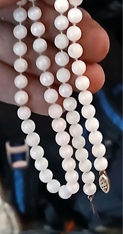 Pearl necklace on 14k gold clasps.