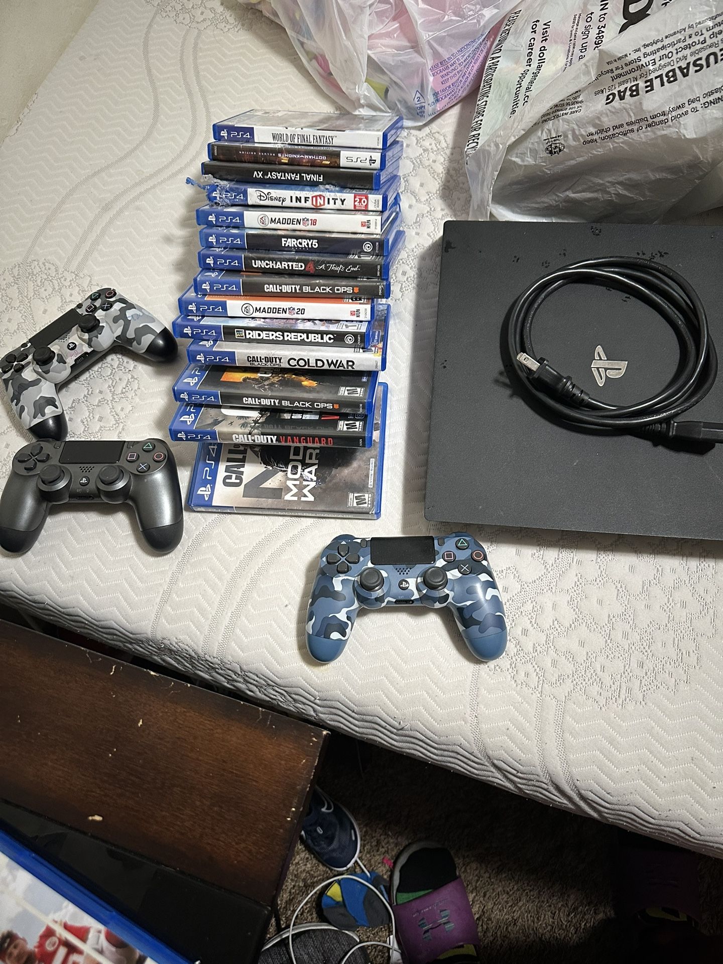 ps4 pro with games and controllers